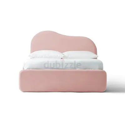 Pink upholstered queen bed with curved headboard