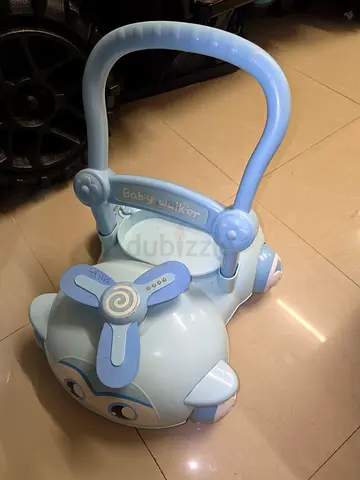 Light blue baby push walker with handle and sounds - good condition