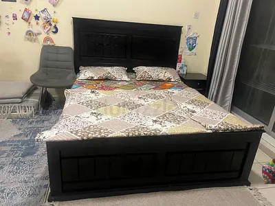 Solid dark wood double bed with headboard and footboard - good condition