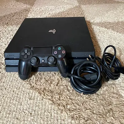Sony PlayStation 4 Pro with DualShock 4 and Cables - Good Condition