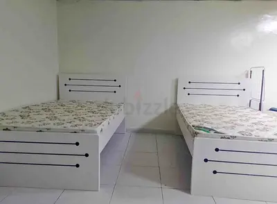 Pair of white single beds with mattresses - good condition