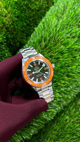 Omega Mens stainless steel dive watch with orange bezel