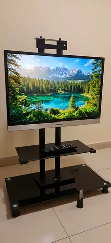 32-inch Toshiba Flat Panel TV +Stand with Remote - Good Condition +*TV STAND* included all belonging