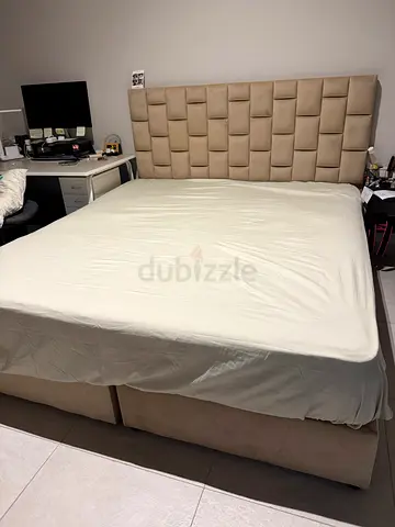 Queen-size upholstered bed frame with padded headboard - beige(aed 650)