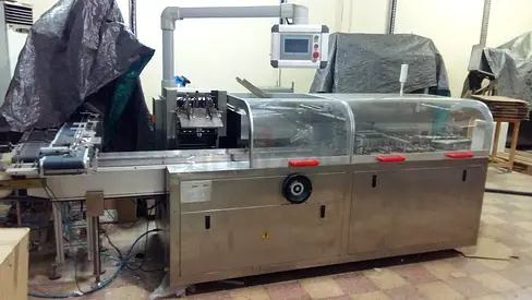 Automatic industrial packaging boxing cartoning machine.