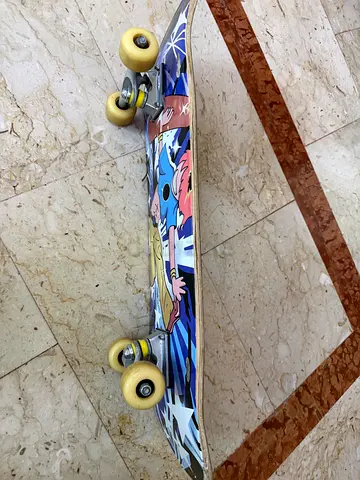 Used Graphic Skateboard with Yellow Wheels - Good Condition