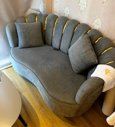 Grey curved 3-seater velvet sofa with gold trim - good condition