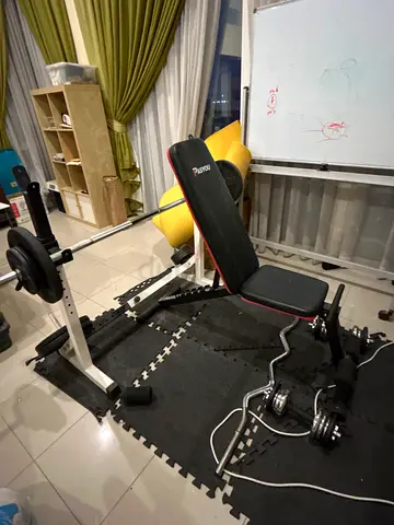 Adjustable weight bench with barbell and - good condition