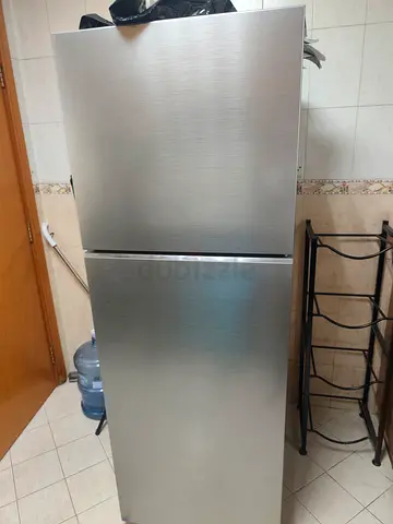 Silver two-door refrigerator with top freezer - excellent working condition