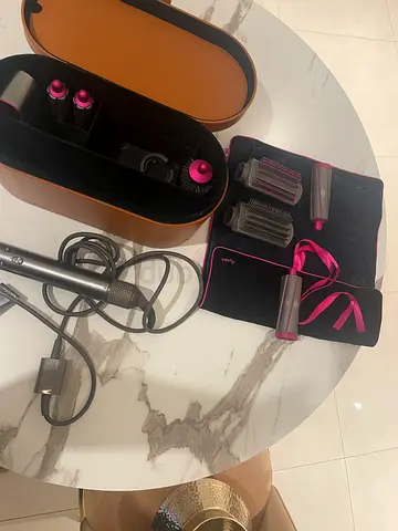 Dyson Airwrap Complete styling set (used) with barrels and brush attachments and travel bag