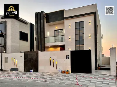 Villa for sale, including registration and ownership fees, near all services, close to Sheikh Mohammed Bin Zayed Road, on a main street, very prime lo
