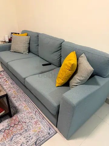 Light blue sectional sofa bed - good condition