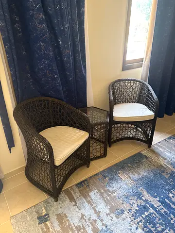 Pair of Wicker Rattan Lounge Chairs, coffee table with Cushions - Good Condition
