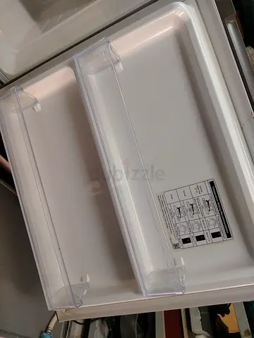 Samsung Silver double-door refrigerator with top freezer - good working condition