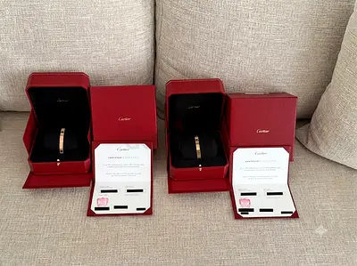 Pair of Cartier Love Bracelets with Boxes and Certificates