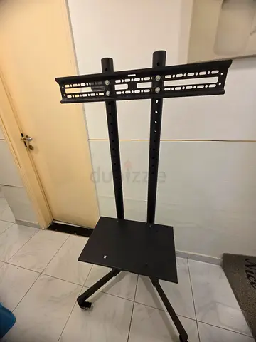 Portable TV stand with wheels - adjustable height mount