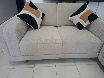 Light grey 2-seater fabric sofa in excellent condition