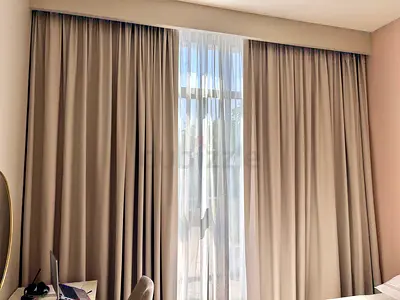 Full-length beige blackout curtains with sheer panels - ready to hang