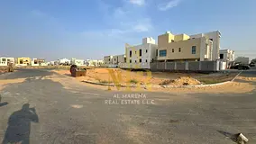 Residential land for sale in a prime location in Al Yasmin area, registration fees included.
