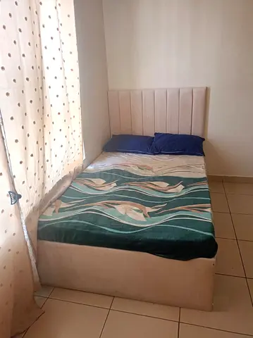Single bed with upholstered headboard and storage base - good condition