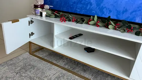 Modern White TV Stand with Gold Base and Storage