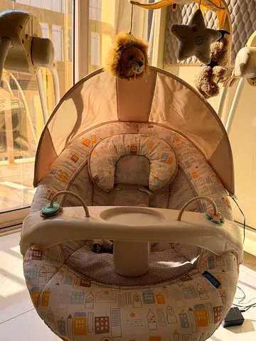 Baby bouncer/rocker seat with canopy and toy bar - good condition