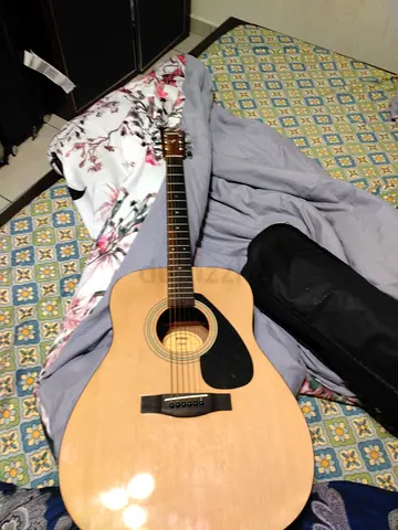 Used acoustic guitar with soft case - good play condition