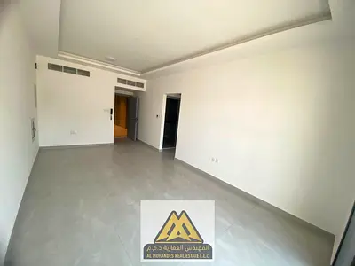For annual rent: Brand-new one-bedroom apartment in Al Jurf 3, Ajman, featuring a living room, 2 bathrooms, balcony, smart card access, modern finishe