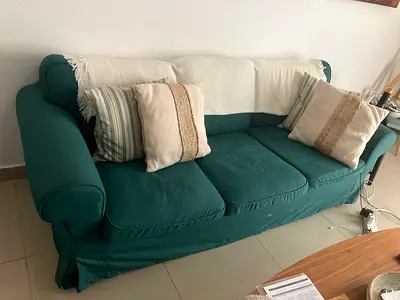 Green 3-seater sofa with removable covers — good condition