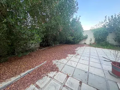 Villa for annual rent in Maysaloon, Sharjah, comprising 4 large bedrooms, a maid's room, a master bedroom, a living room, a majlis, and a large yard.