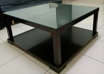URGENT SALE AS WE ARE MOVING OUT THIS MONTH Dark Top Coffee Table with Lower Shelf - Good Condition