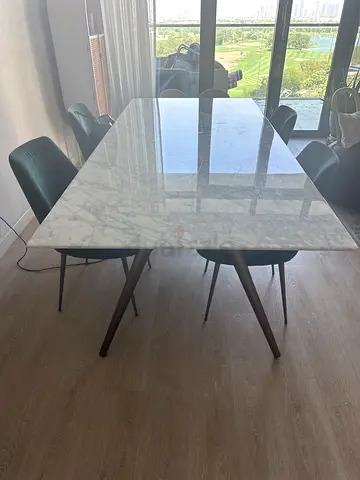 Indigo Marble-top dining table with wooden legs - good condition
