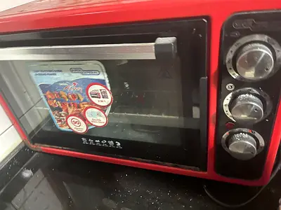 Red countertop electric oven in good working condition