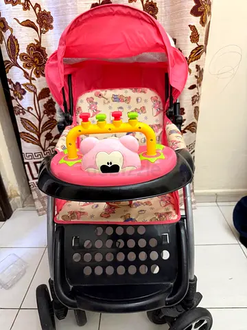 Pink Baby Stroller with Toy Tray and Sun Canopy