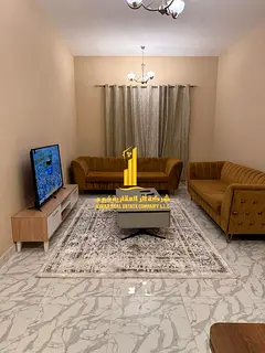 Luxury one-bedroom apartment with a living room and balcony offering an open view. Ajman, Al Rashidi