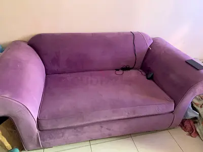 Two-seater purple velvet sofa — good condition