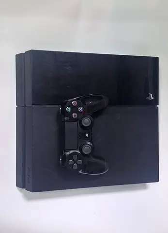 PlayStation 4 (PS4) console with DualShock 4 controller - good working condition