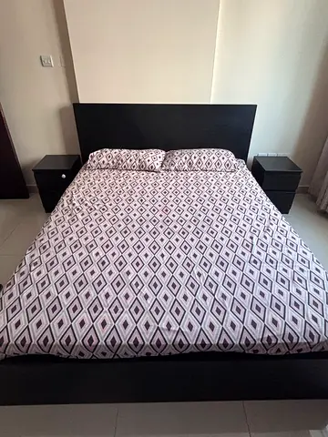 Ikea King size bed 180x200. black color. Bed set with 2 side tables and mattress.