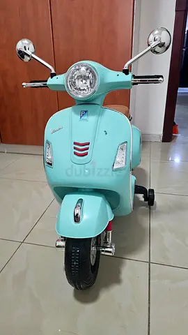 Vespa Light Blue Kids Electric Ride-On Scooter with Seat