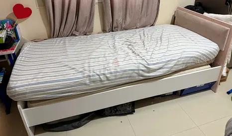 Single bed with upholstered headboard
