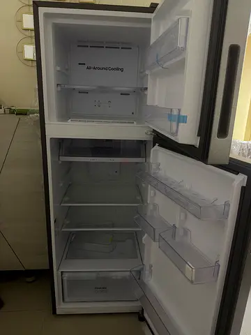 Used double-door refrigerator with freezer, good working condition