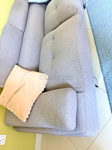 Light grey 4 -seater L shape fabric sofa in good condition