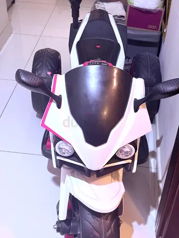 White and red kids electric ride-on motorcycle - good working condition