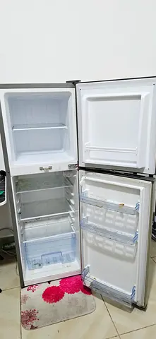 Used White Double-Door Refrigerator - Good performance Working Condition. Never repaired like new