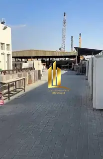 For sale: A compound in Emirates Industrial City featuring three rooms, an open canopy, and an outdo