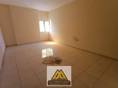 Annual rent: 1-bedroom apartment in Al Nuaimiya 1 with balcony, central AC, free maintenance, near Gulfa Bridge, AED 28,000, payable in 4 installments