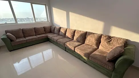 Large L-shaped Green Fabric Sofa — Good Condition
