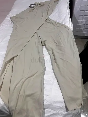 Beige womens jumpsuit - size tag not visible.