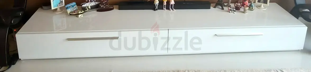 Low-profile white glossy TV cabinet with two drawers - modern design