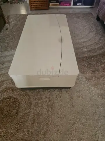 White folding coffee table / storage bench in good condition
